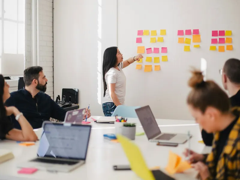 A team planning session at the whiteboard